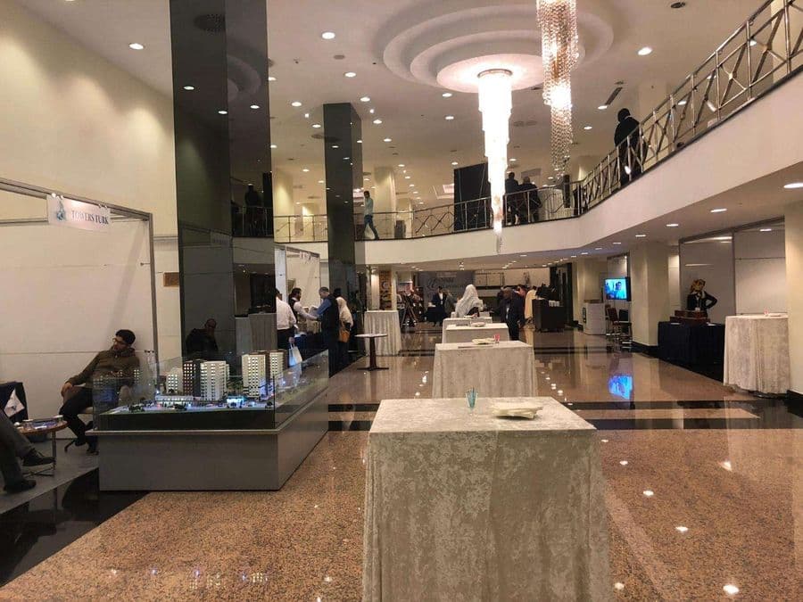 a large room with a large building with a glass display case