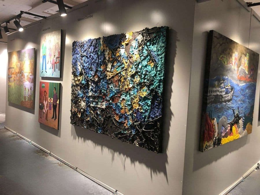 a group of paintings on a wall